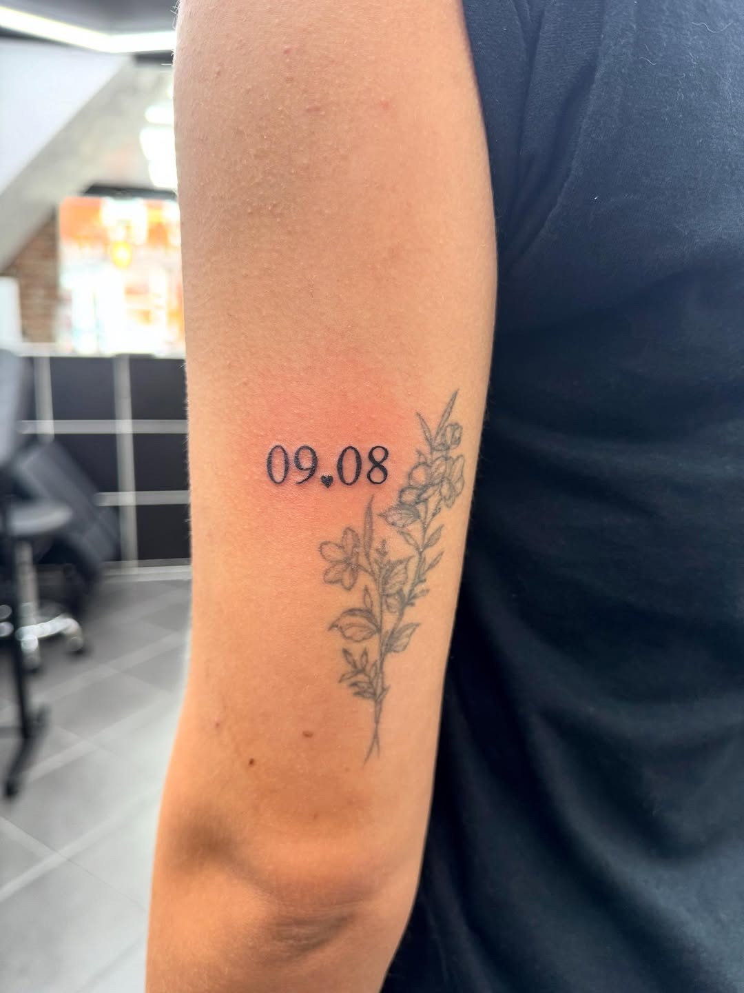 A beautiful date tattoo with floral accents Tattoo Design