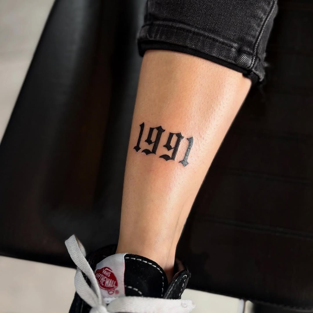 Bold 1991 Tattoo on Leg Tattoo Design