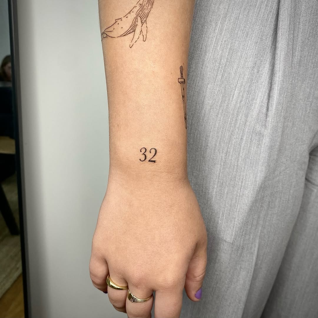 Elegant date tattoo on the forearm Tattoo Design
