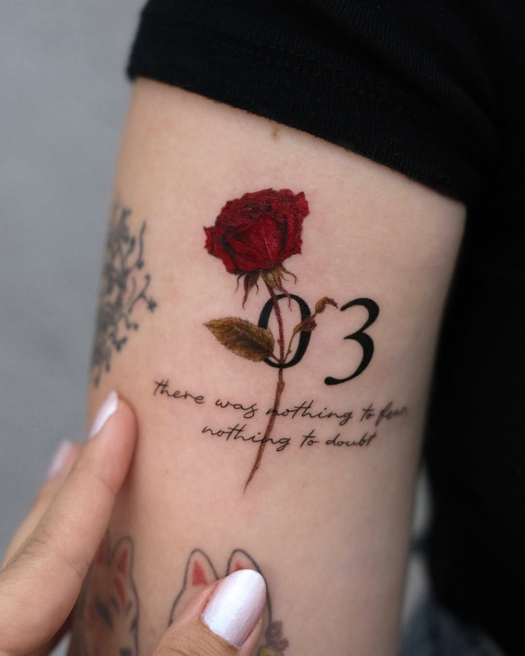 Elegant rose tattoo with a meaningful date Tattoo Design
