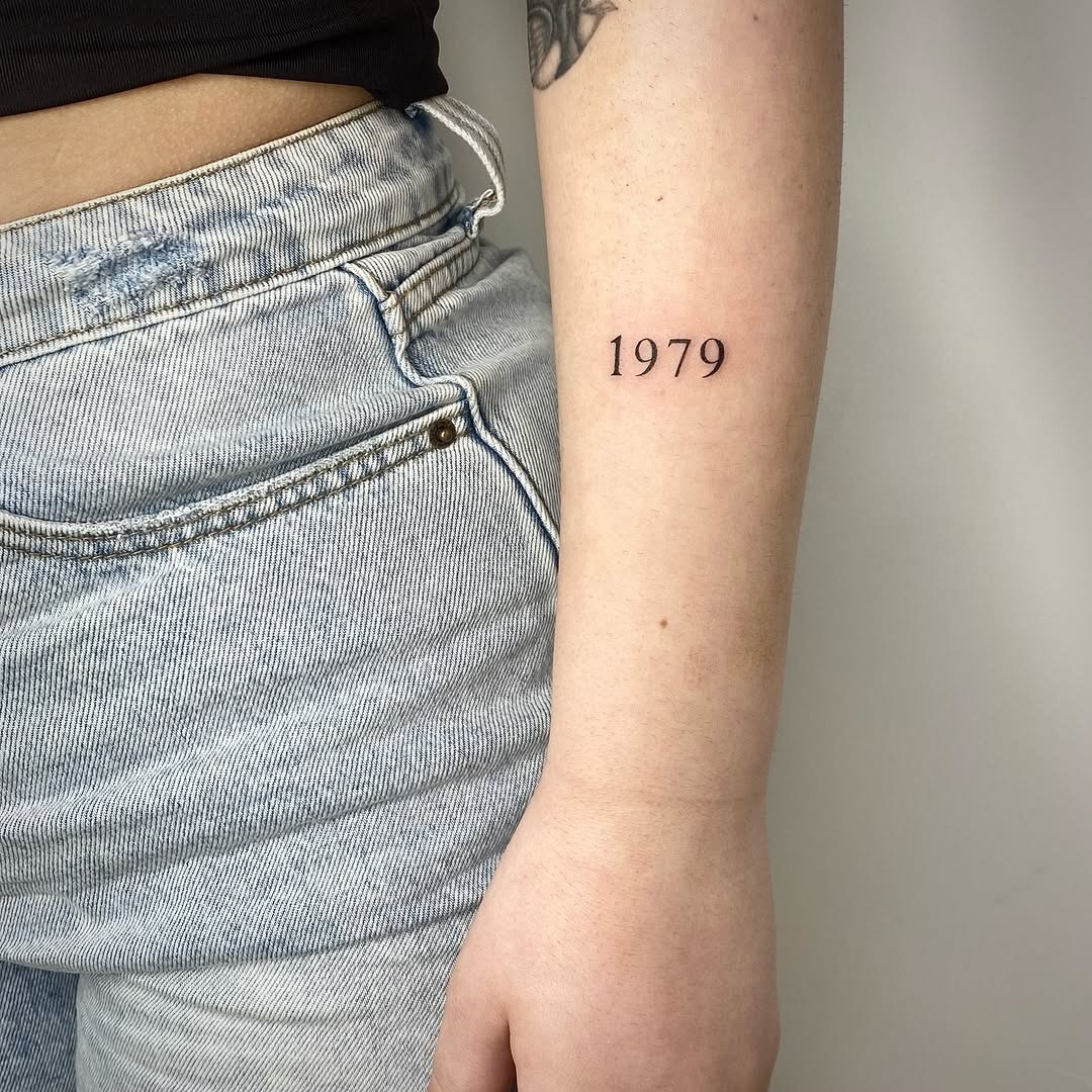 Minimalist date tattoo in elegant script Tattoo Design
