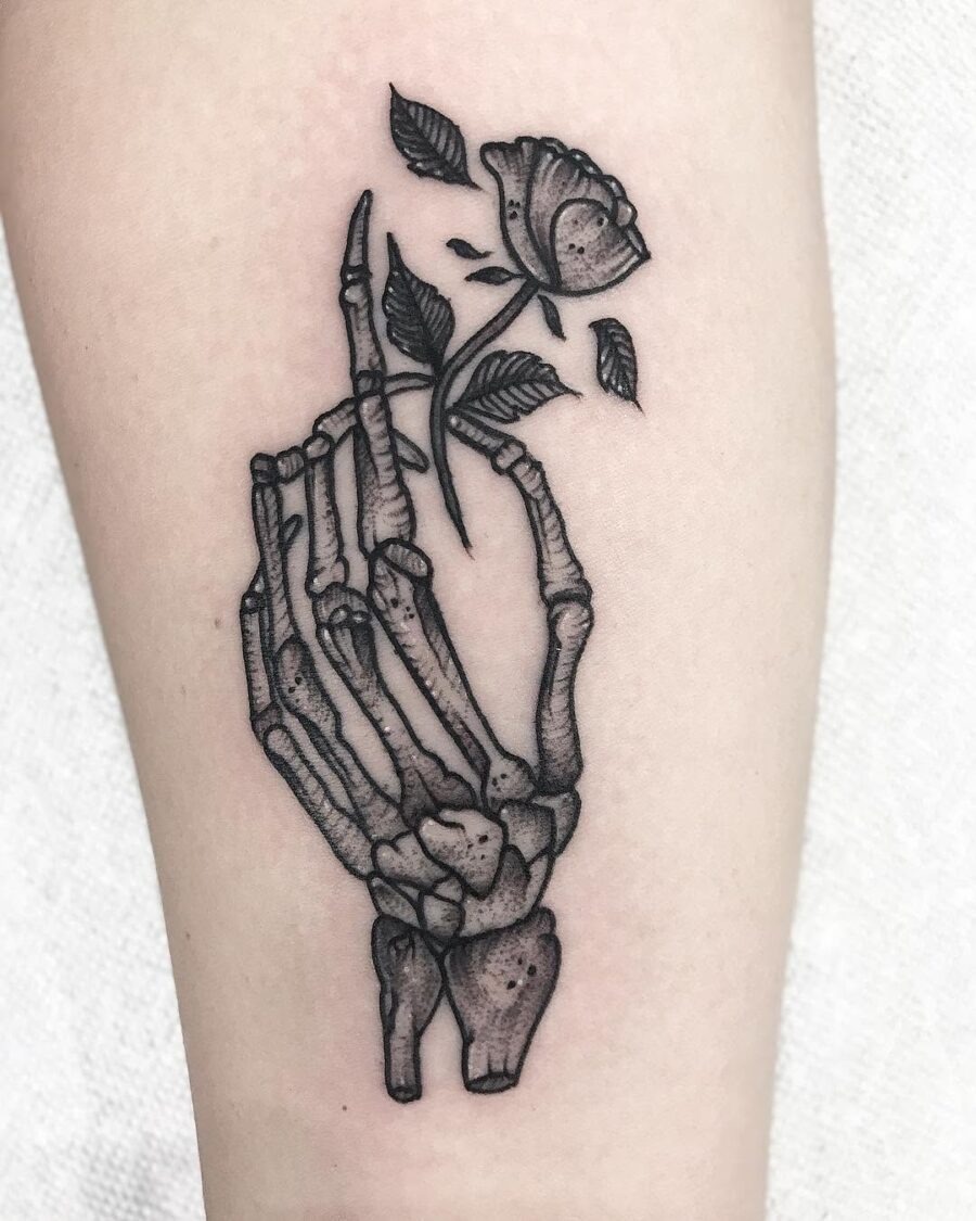 Artful blend of skeleton hand and rose Tattoo Design