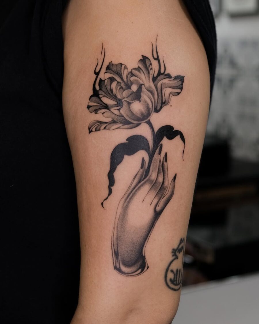Elegant dead flower tattoo with a hand gesture Tattoo Design