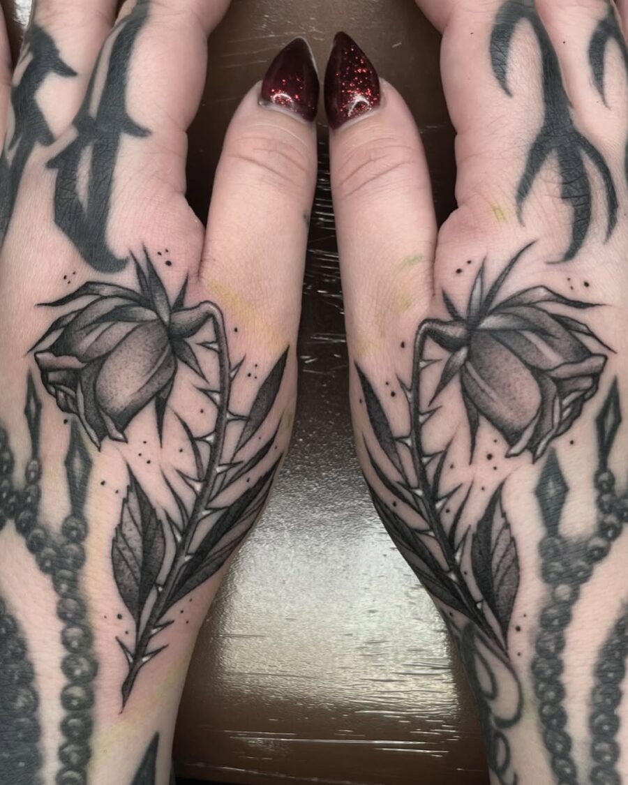 Elegant dead roses on hands create striking contrast Tattoo Design