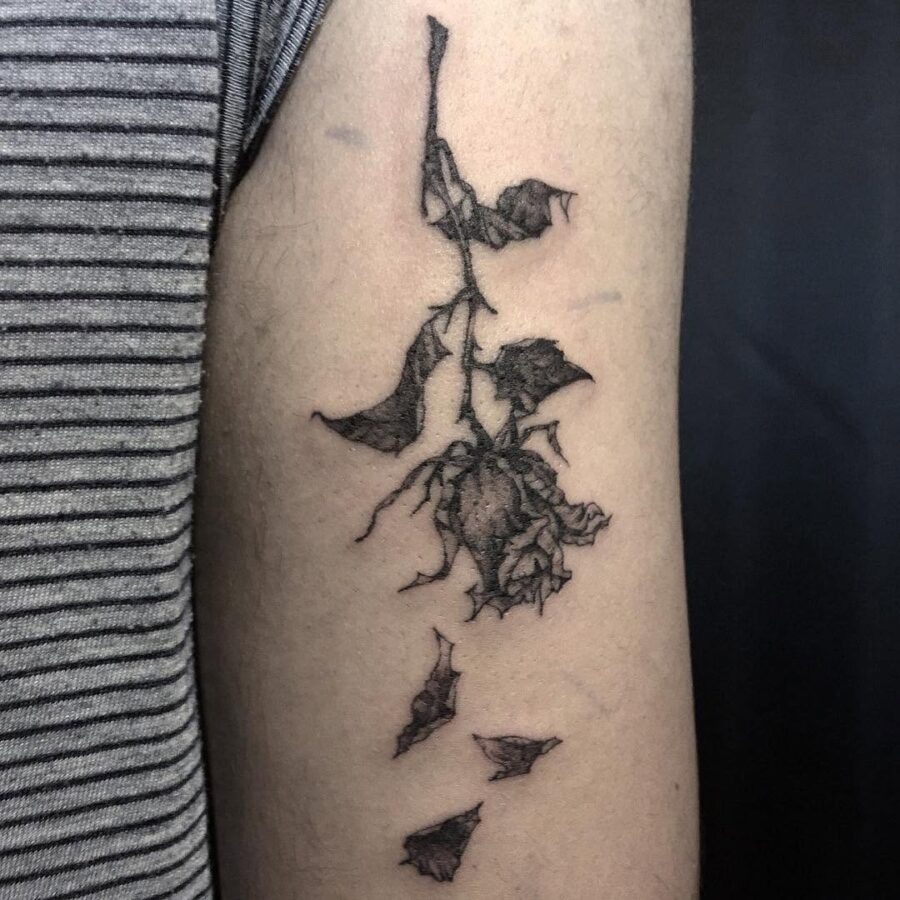 Elegant drooping rose with fallen petals Tattoo Design
