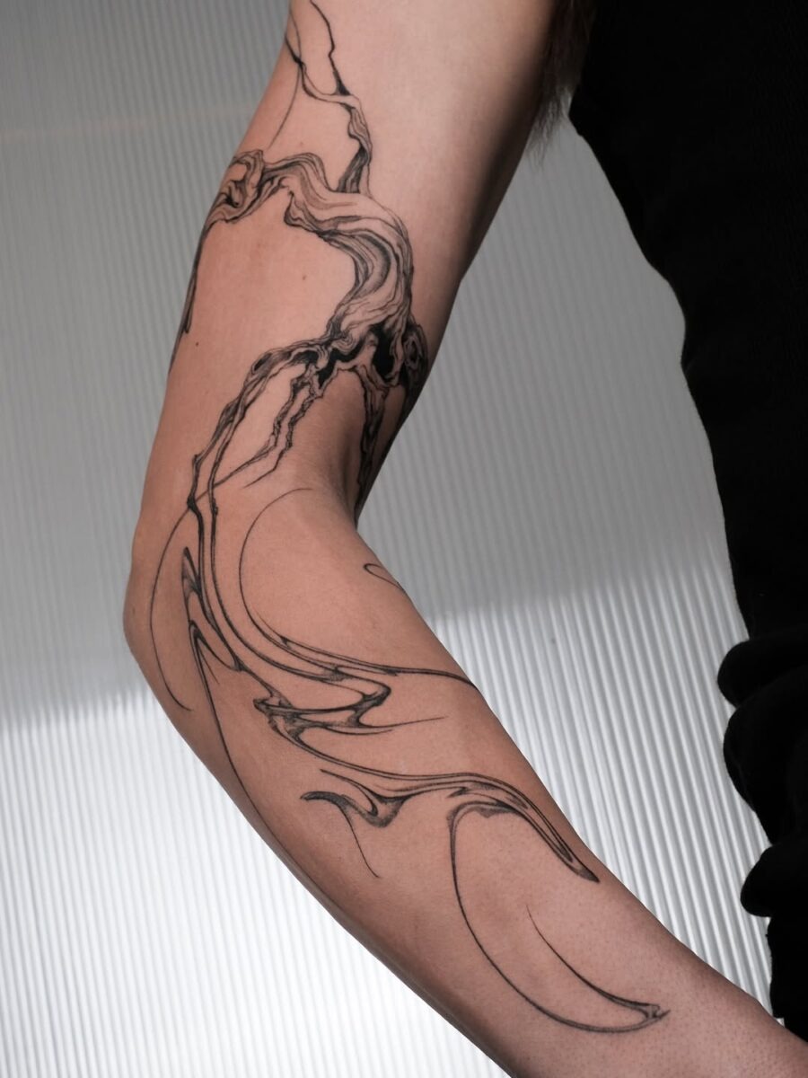 Elegant minimalism captured in floral ink design. Tattoo Design