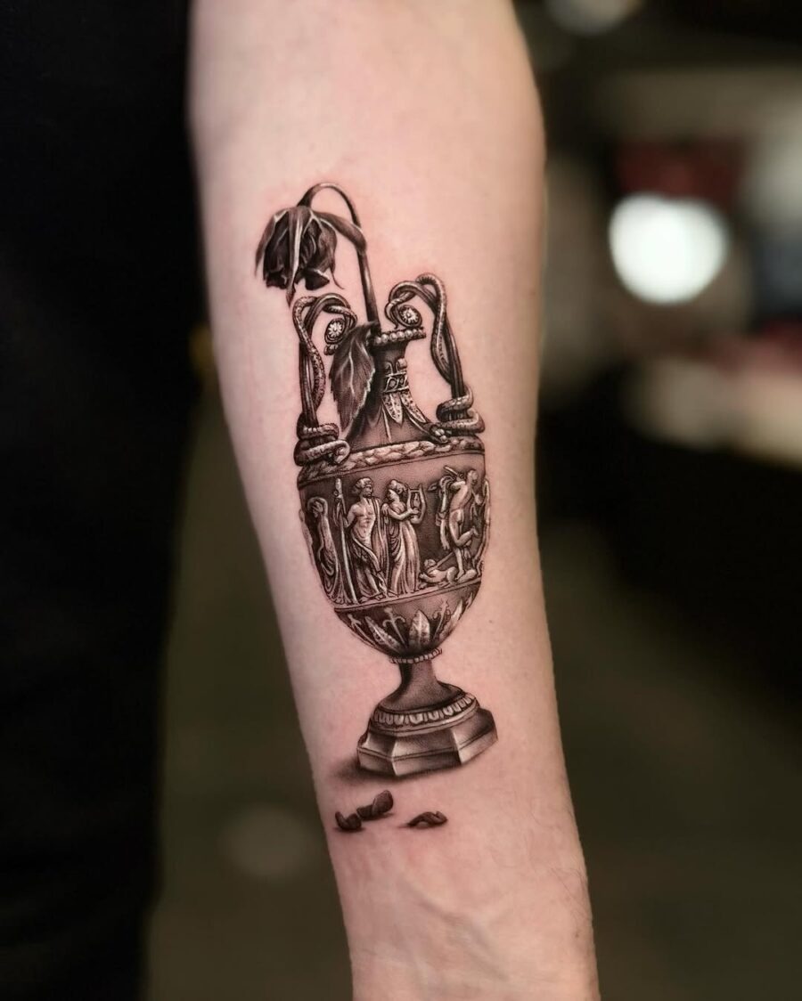 Intricate vase tattoo with a wilted flower Tattoo Design