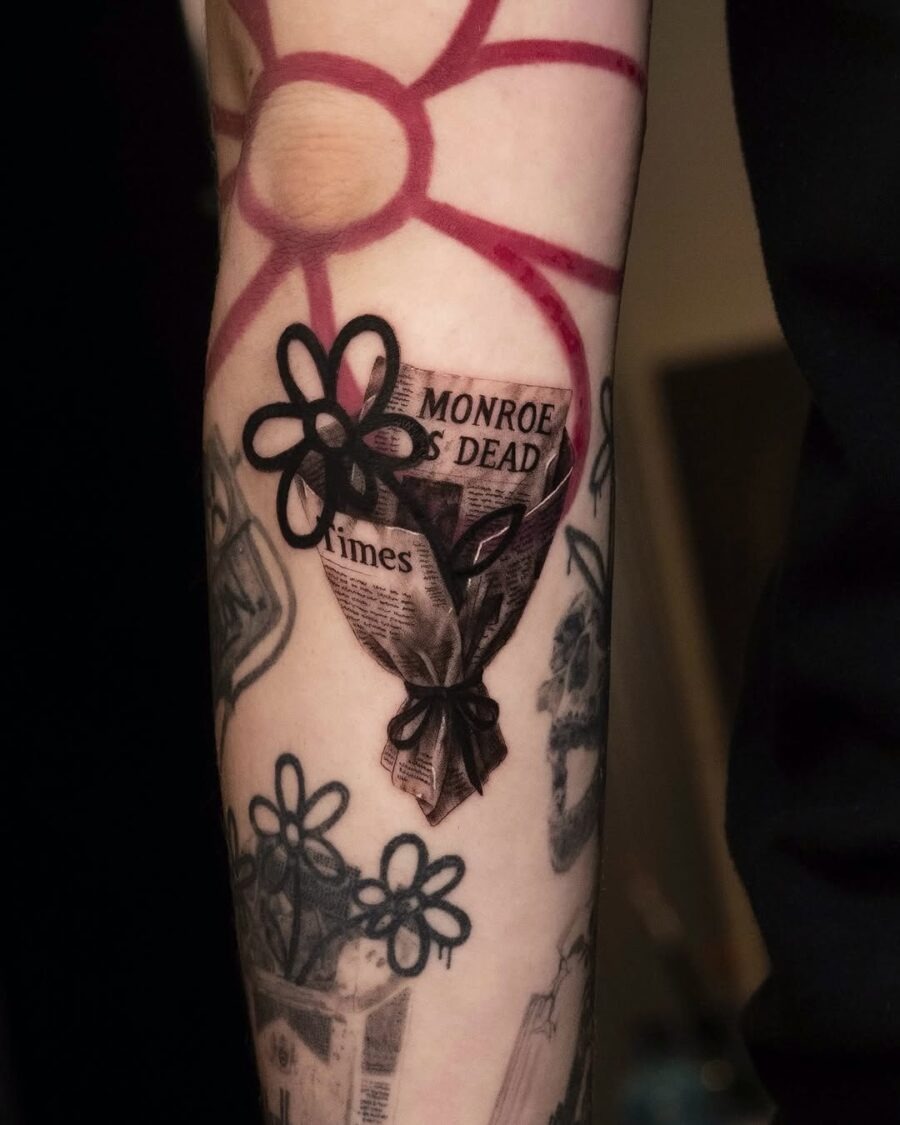 Unique dead flower tattoo with newspaper design Tattoo Design