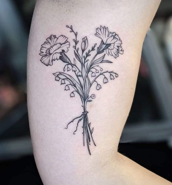 Showing a bouquet of carnations and lily of the valley, this tattoo stands out for its classic floral elegance.