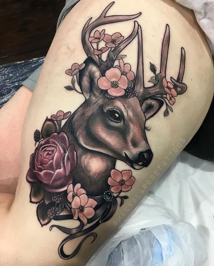 Elegant Deer with Blossoms, a tattoo design rendered in realistic portrait-style for the arm.