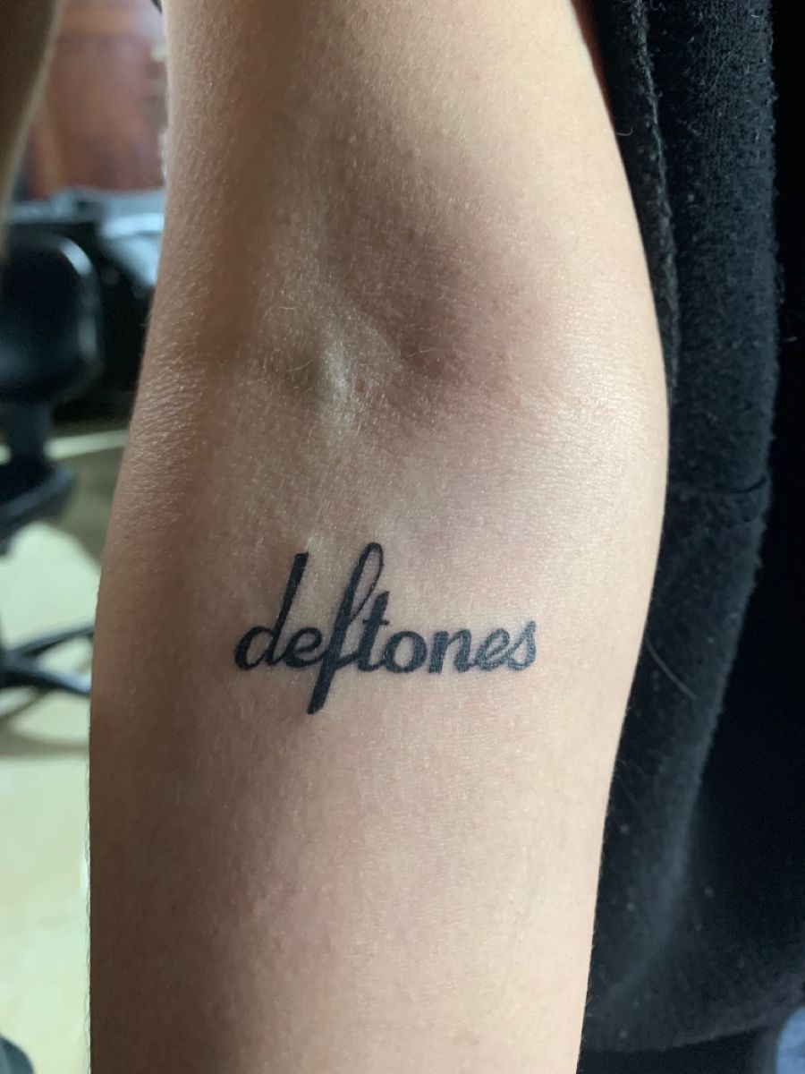 Simple Forearm Logo Script Tattoo Design