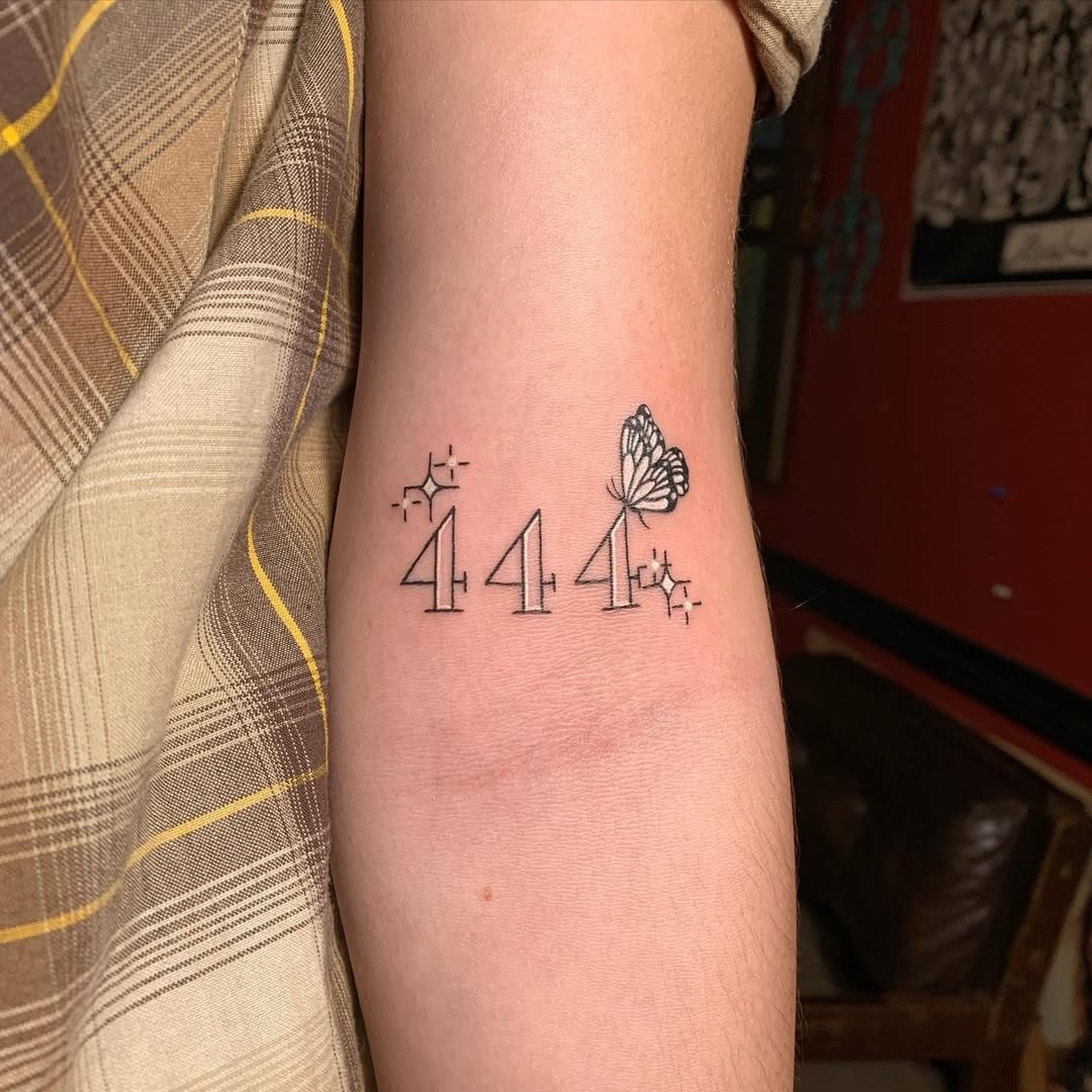 Minimalistic 444 tattoo with a butterfly design Tattoo Design