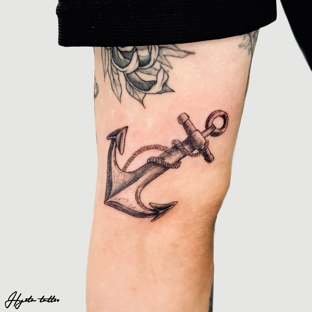 Elegant black ink anchor tattoo on leg Tattoo Design