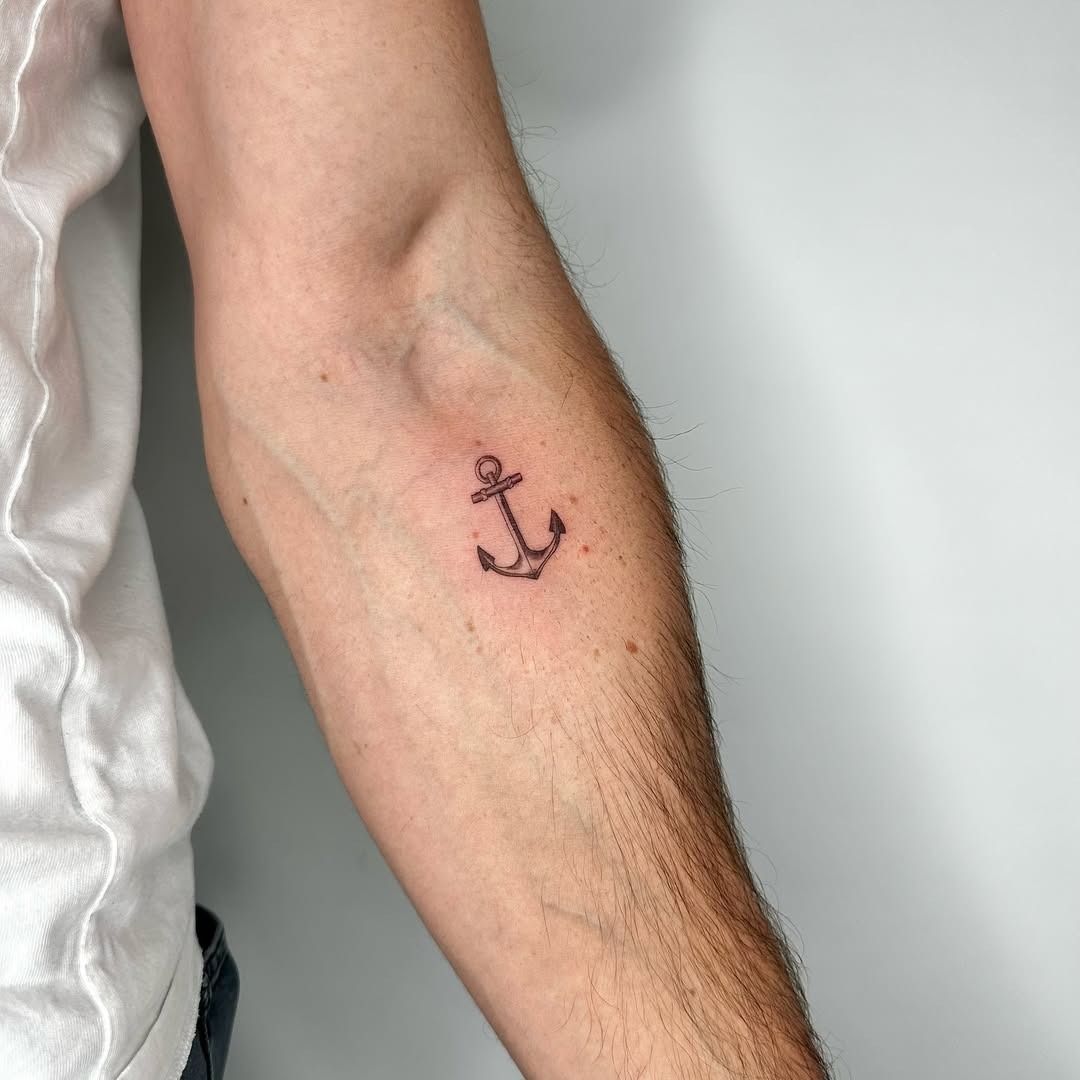 Minimalist anchor tattoo on forearm Tattoo Design