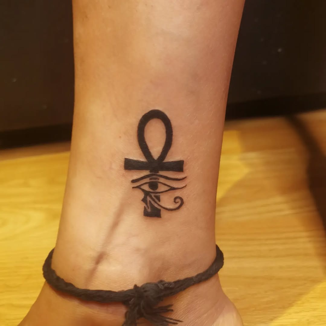 Elegant ankh tattoo with Eye of Horus details Tattoo Design