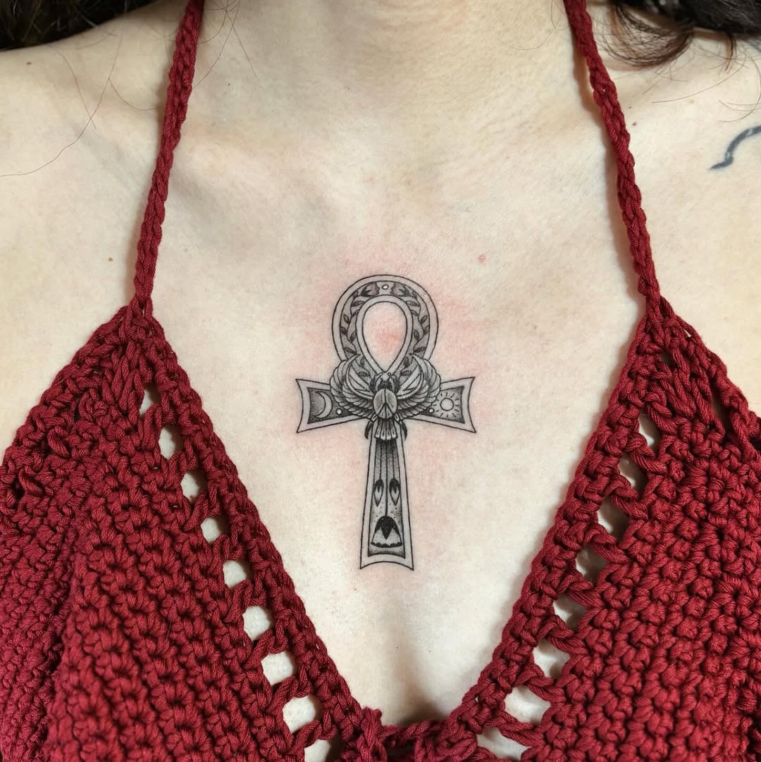 Elegant ankh tattoo with floral accents Tattoo Design