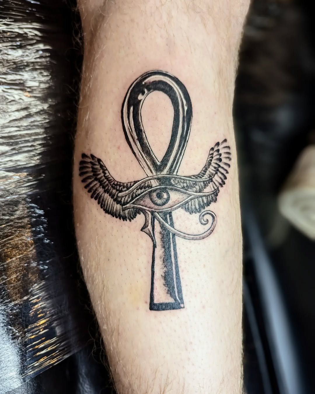 Intricate winged ankh tattoo with symbols Tattoo Design
