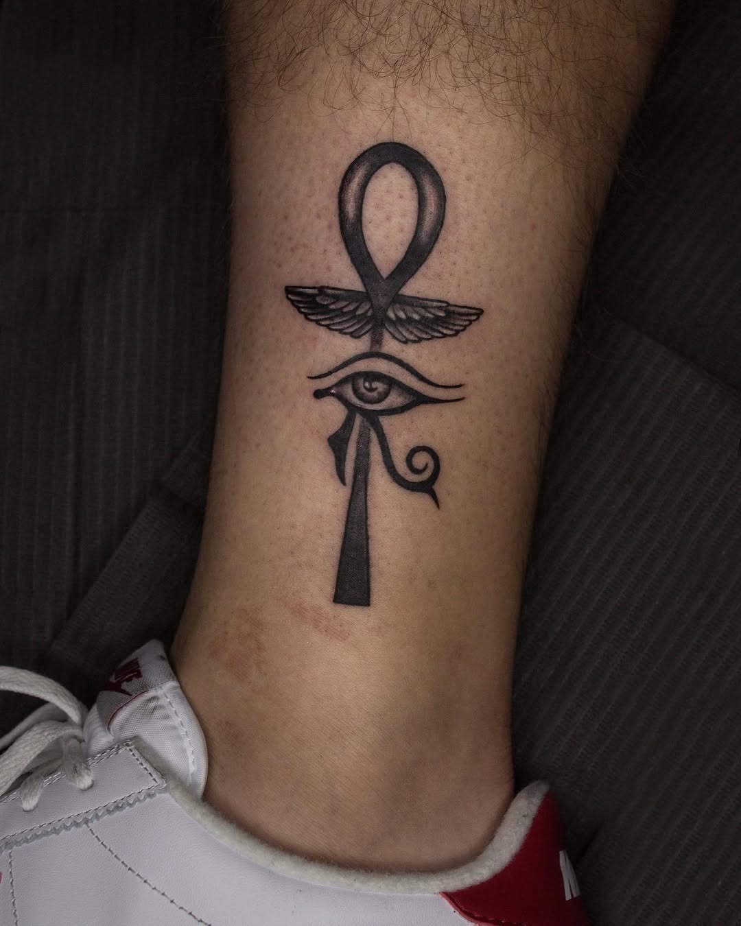 Minimalist Ankh Tattoo on Upper Arm Tattoo Design