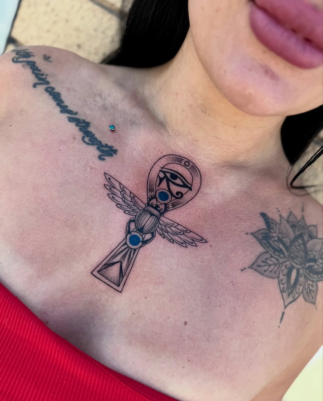 Symbol of life adorned with wings Tattoo Design