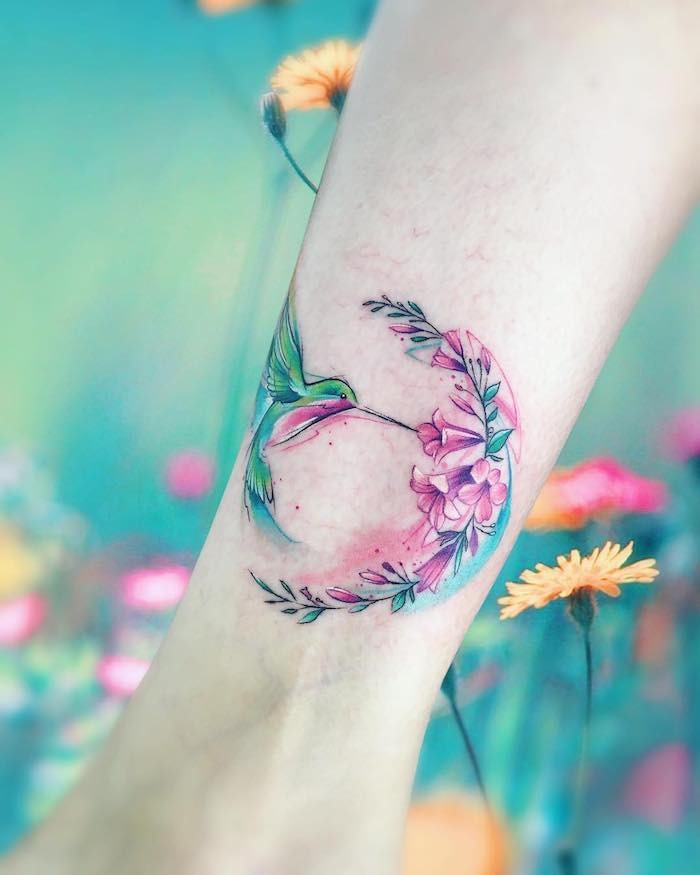 Hummingbird with Sprig of Flowers and Leaves Tattoo Design