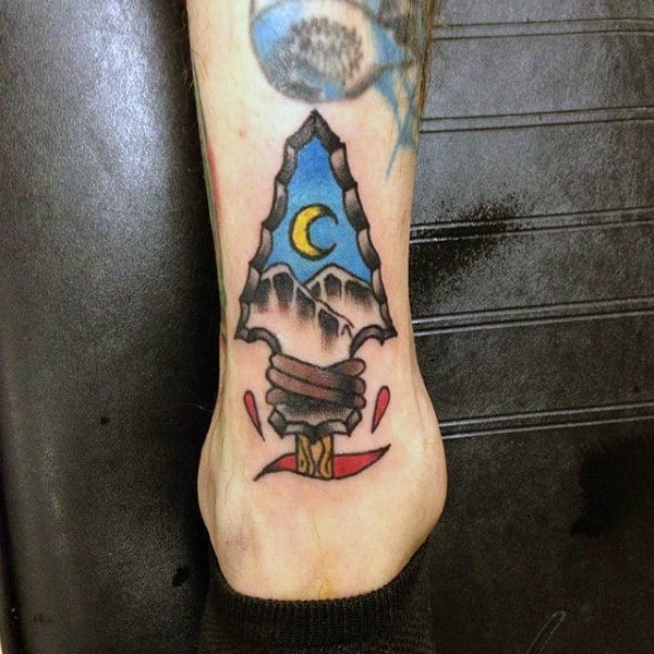 Moon and Mountains in an Arrowhead Tattoo Design