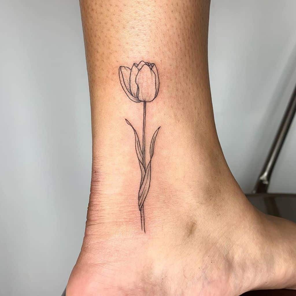 Single Tulip Stem with Leaves Ankle Tattoo Tattoo Design
