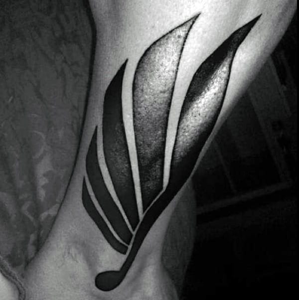 Stylized Wing In Deep Blacks ankle tattoo Tattoo Design