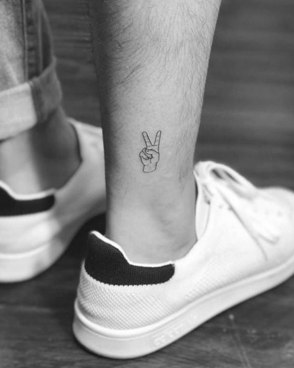 Tiny Hand Holding Up Two Fingers ankle tattoo Tattoo Design