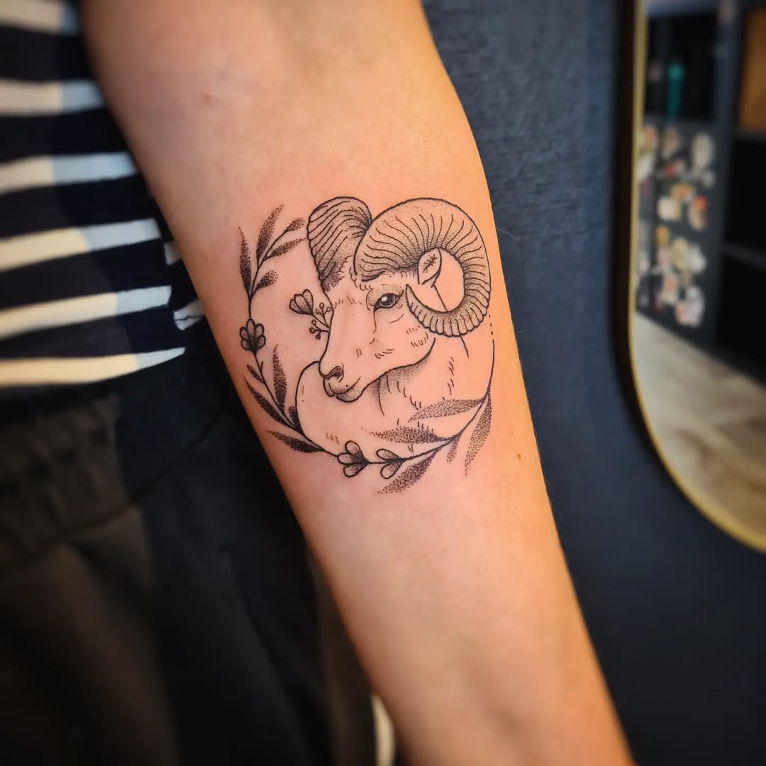 Elegant Aries Ram Tattoo with Floral Accents Tattoo Design