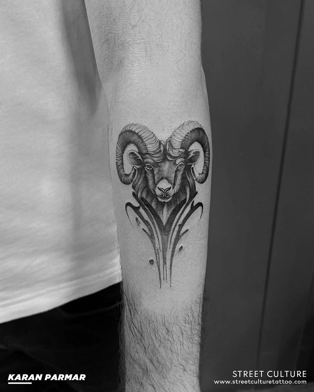 Intricate ram head tattoo with floral accents Tattoo Design