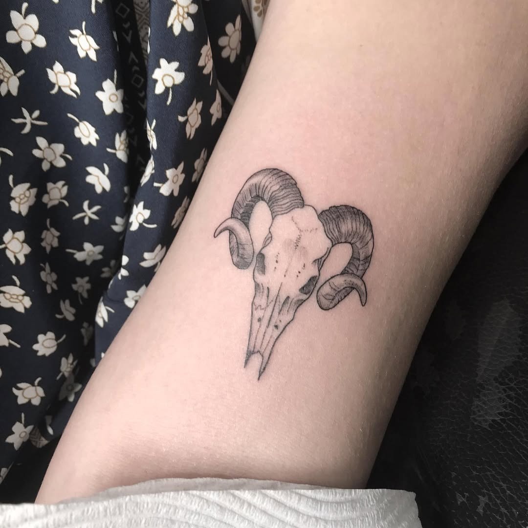 Intricate ram skull tattoo symbolizing Aries Tattoo Design