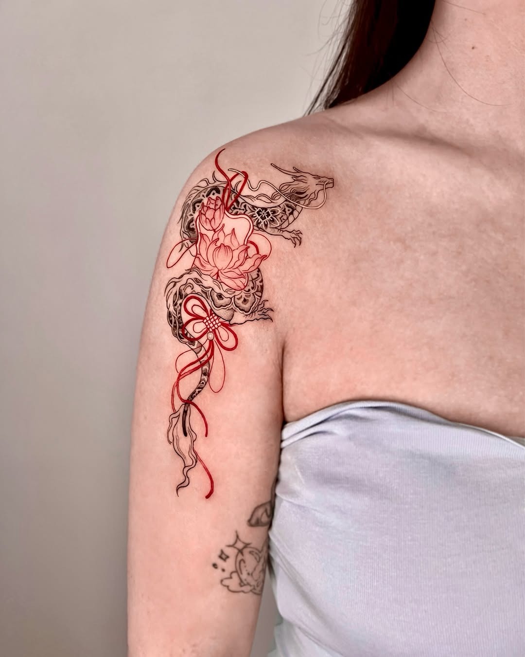 Elegant dragon and lotus arm tattoo design Tattoo Design