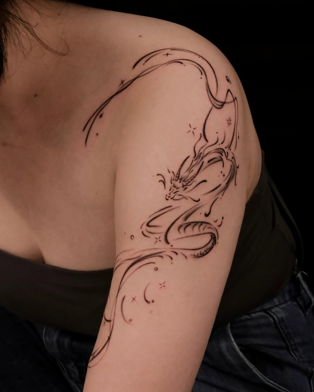 Elegant dragon tattoo design for women’s arm Tattoo Design