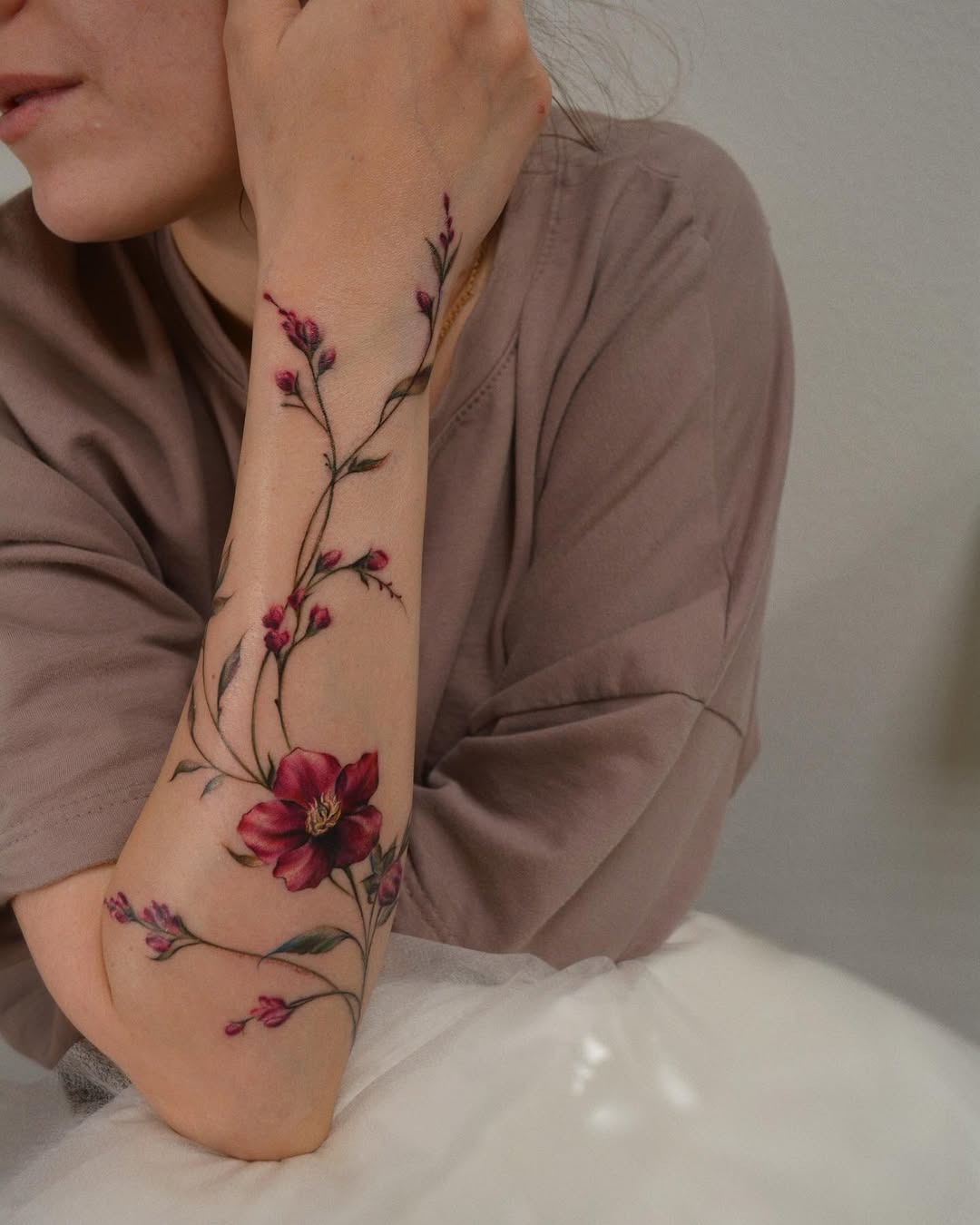 Elegant floral arm tattoo design for women Tattoo Design