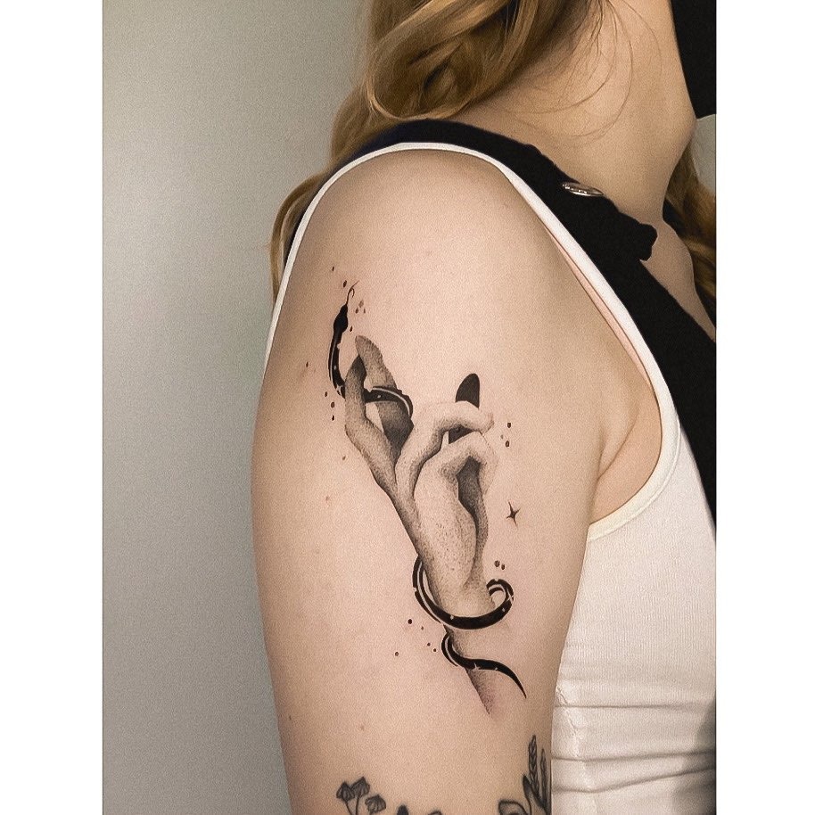 Elegant hand tattoo with flowing ribbon design Tattoo Design