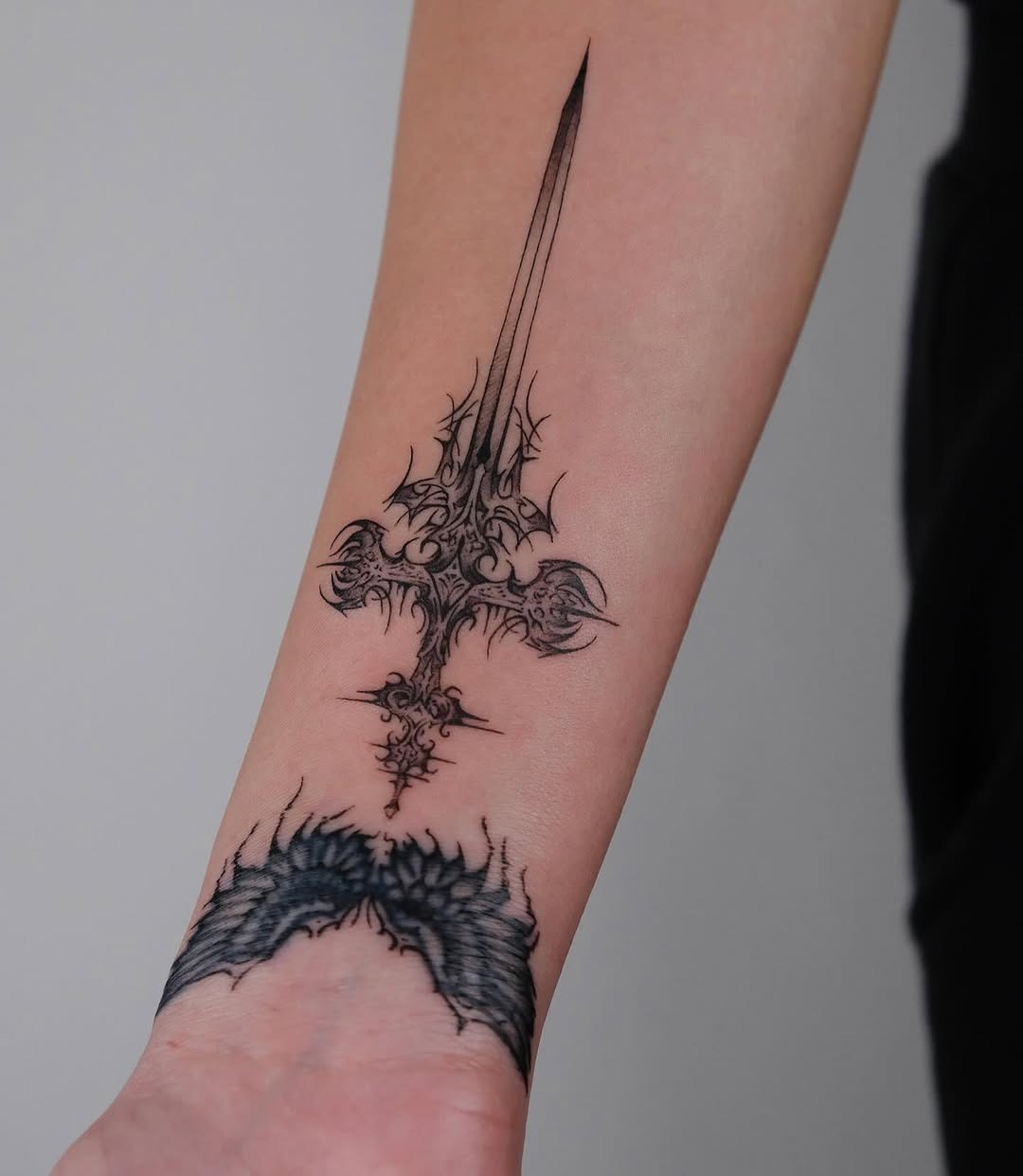 Elegant sword tattoo with intricate details. Tattoo Design