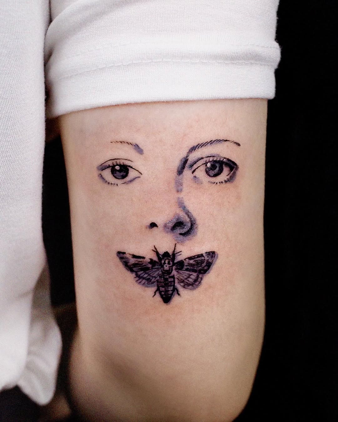 Intricate tattoo of a face and butterfly Tattoo Design