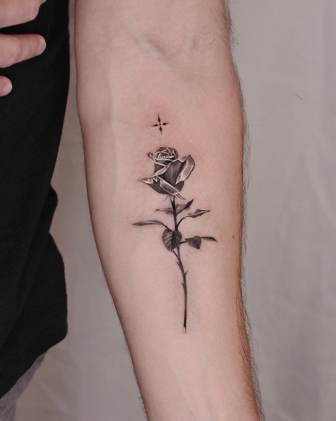Stunning rose tattoo on a woman’s forearm Tattoo Design