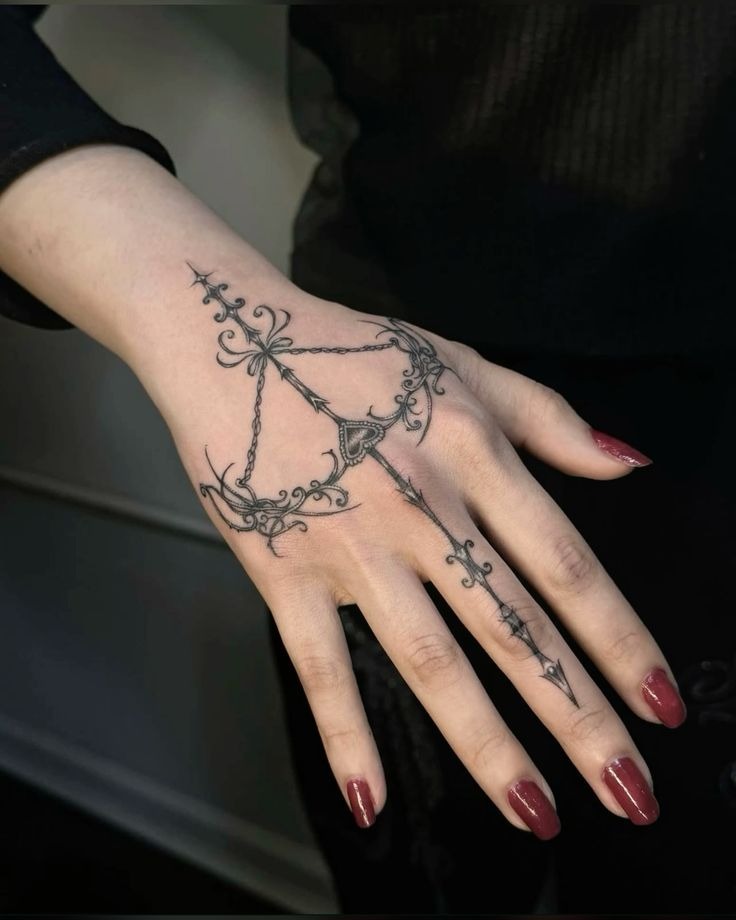 Delicate Bow Arrow Hand Design Tattoo Design