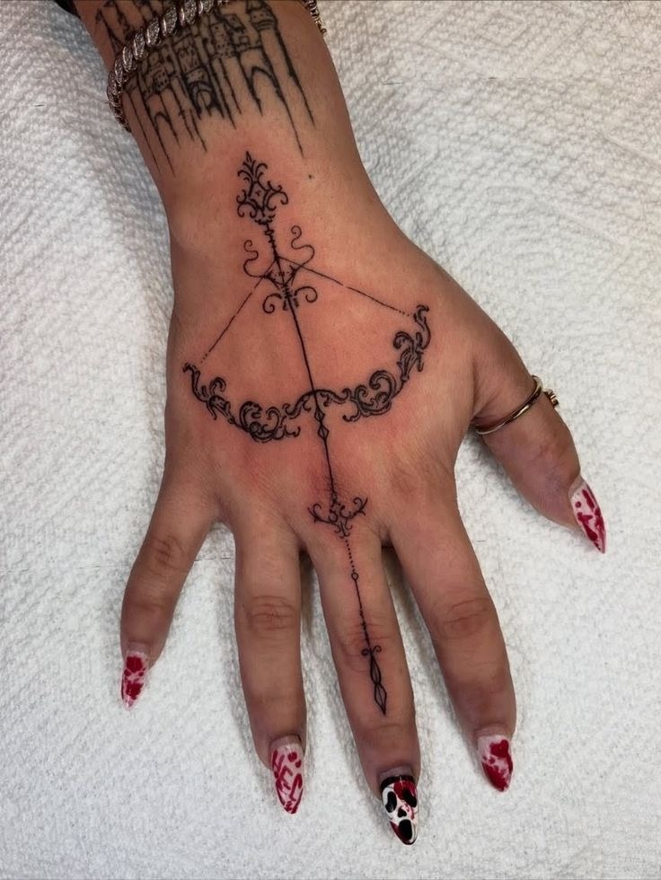 Ornamental Bow and Arrow Hand Tattoo Tattoo Design