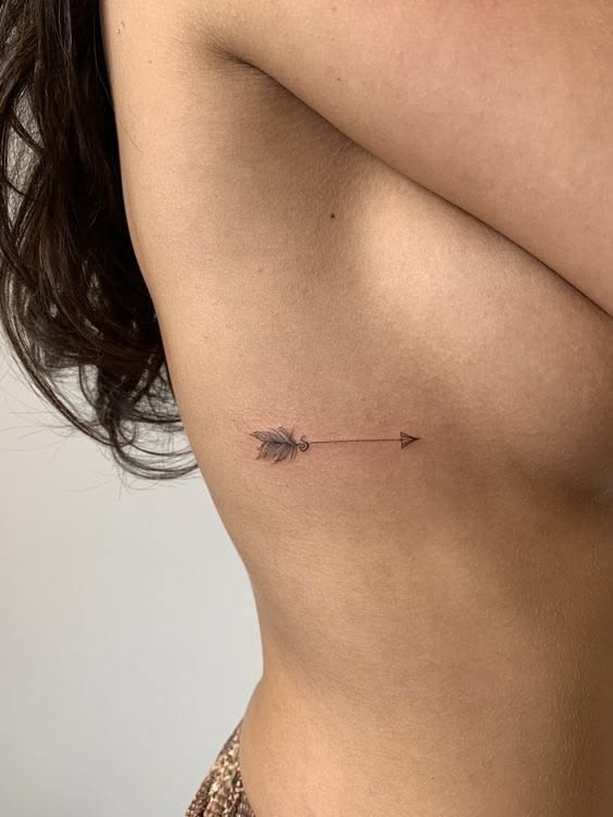 Tiny Feather Arrow Rib Tattoo Tattoo Design