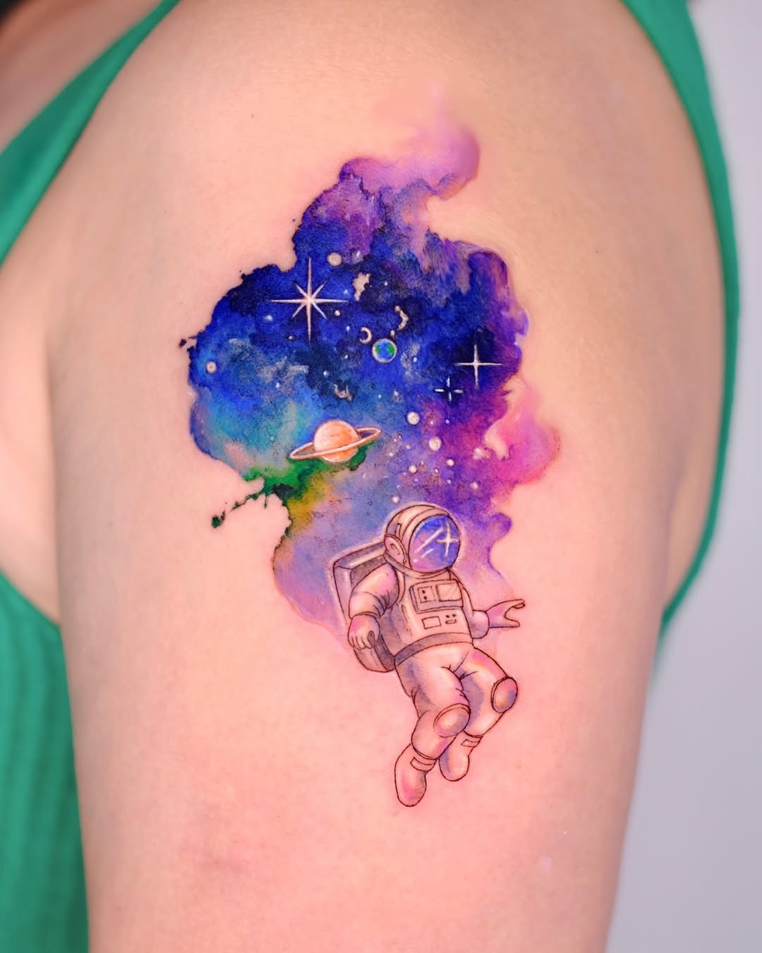 A Cosmic Astronaut in a Vibrant Galaxy Tattoo Design