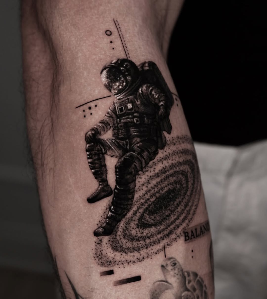 Astronaut tattoo capturing cosmic serenity and balance. Tattoo Design
