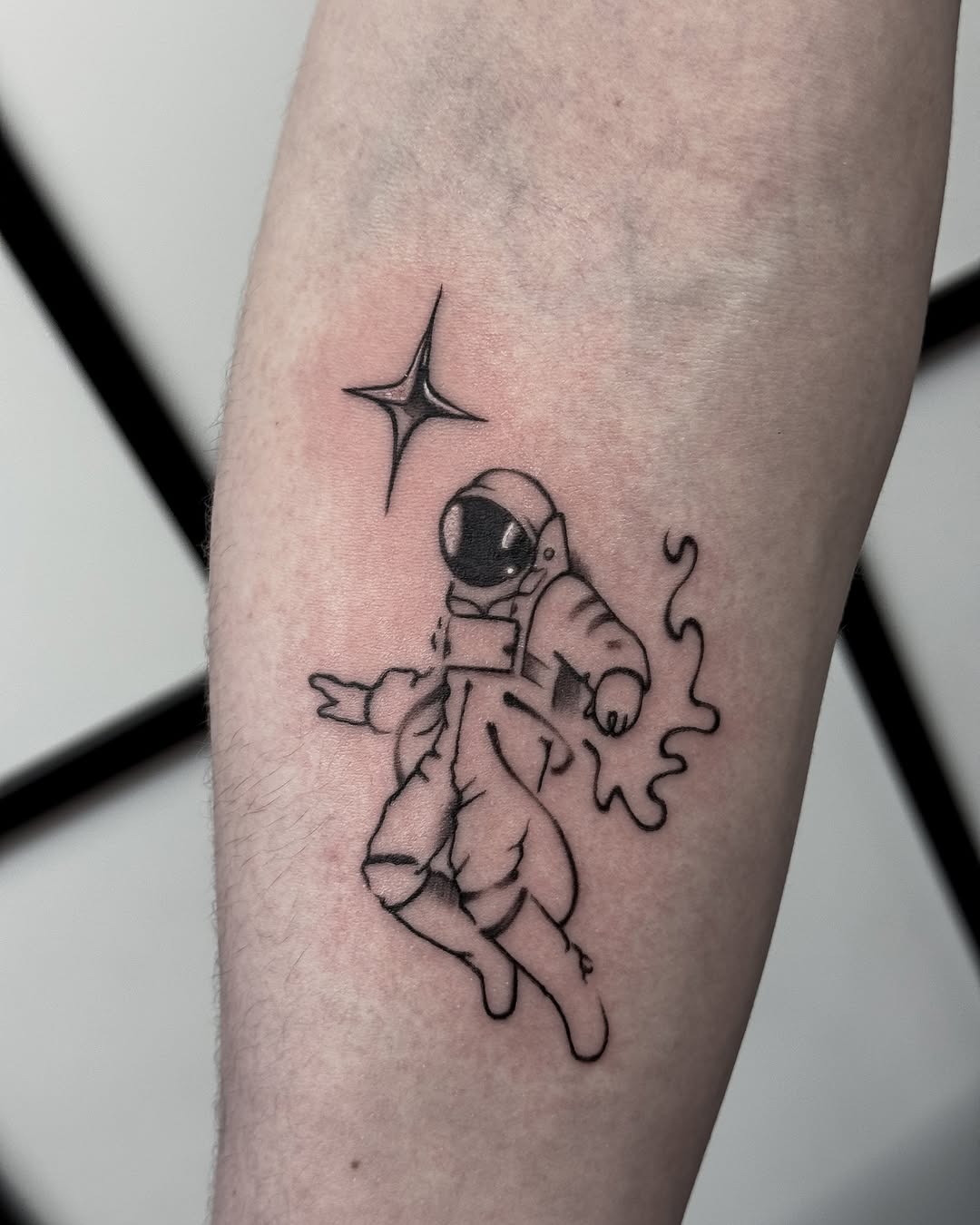 Charming astronaut tattoo exuding playful vibes Tattoo Design