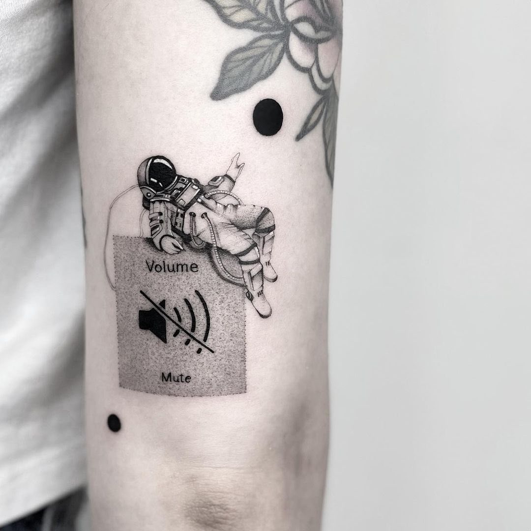 Creative tattoo blending astronaut and sound controls Tattoo Design