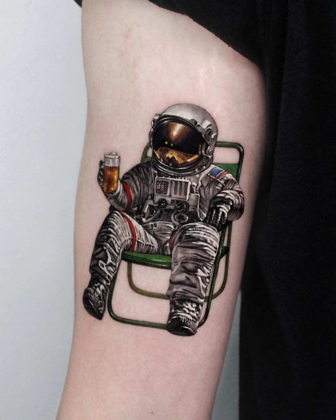 Relaxed astronaut enjoying a drink on Earth. Tattoo Design