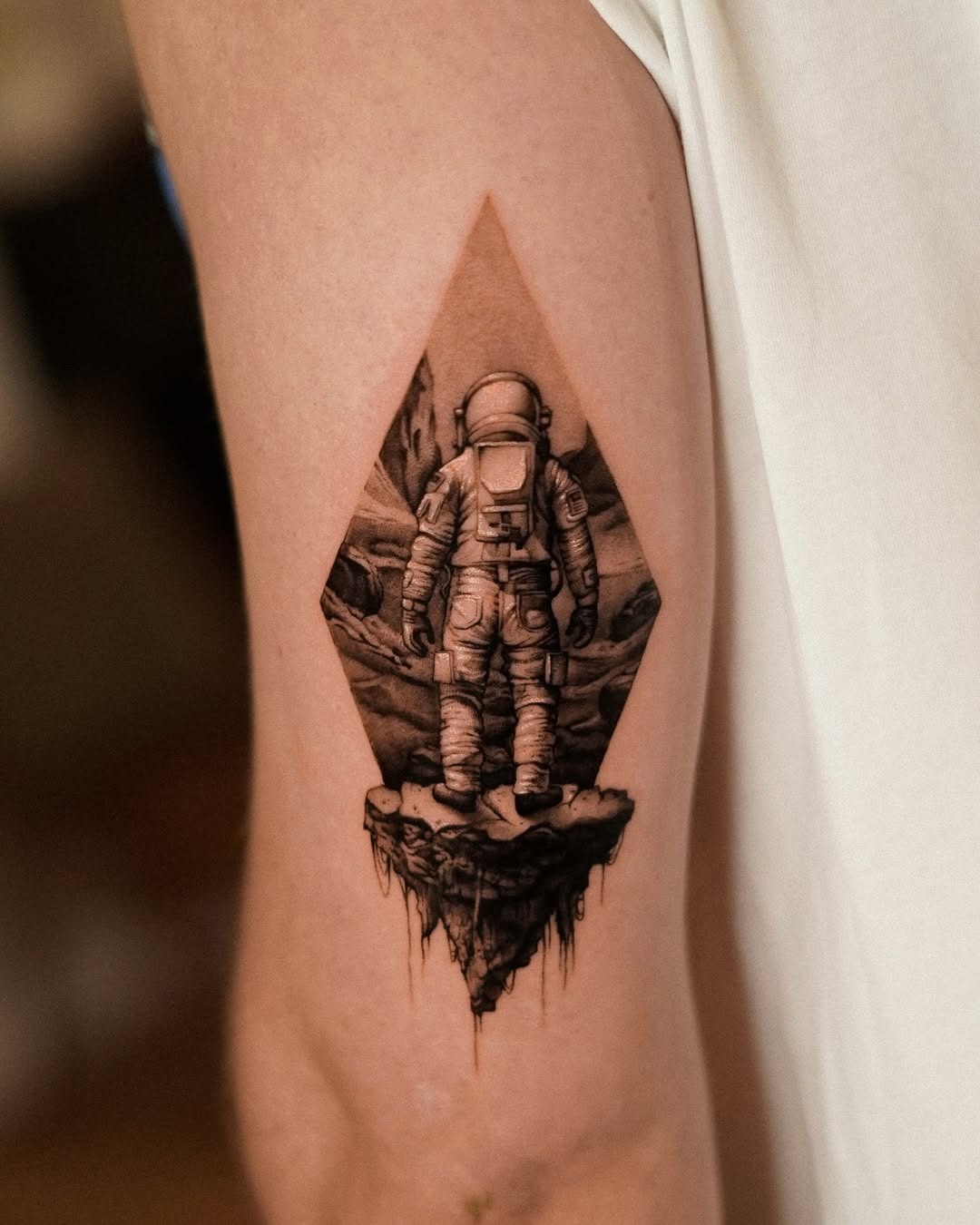 Stunning astronaut tattoo in a cosmic setting Tattoo Design