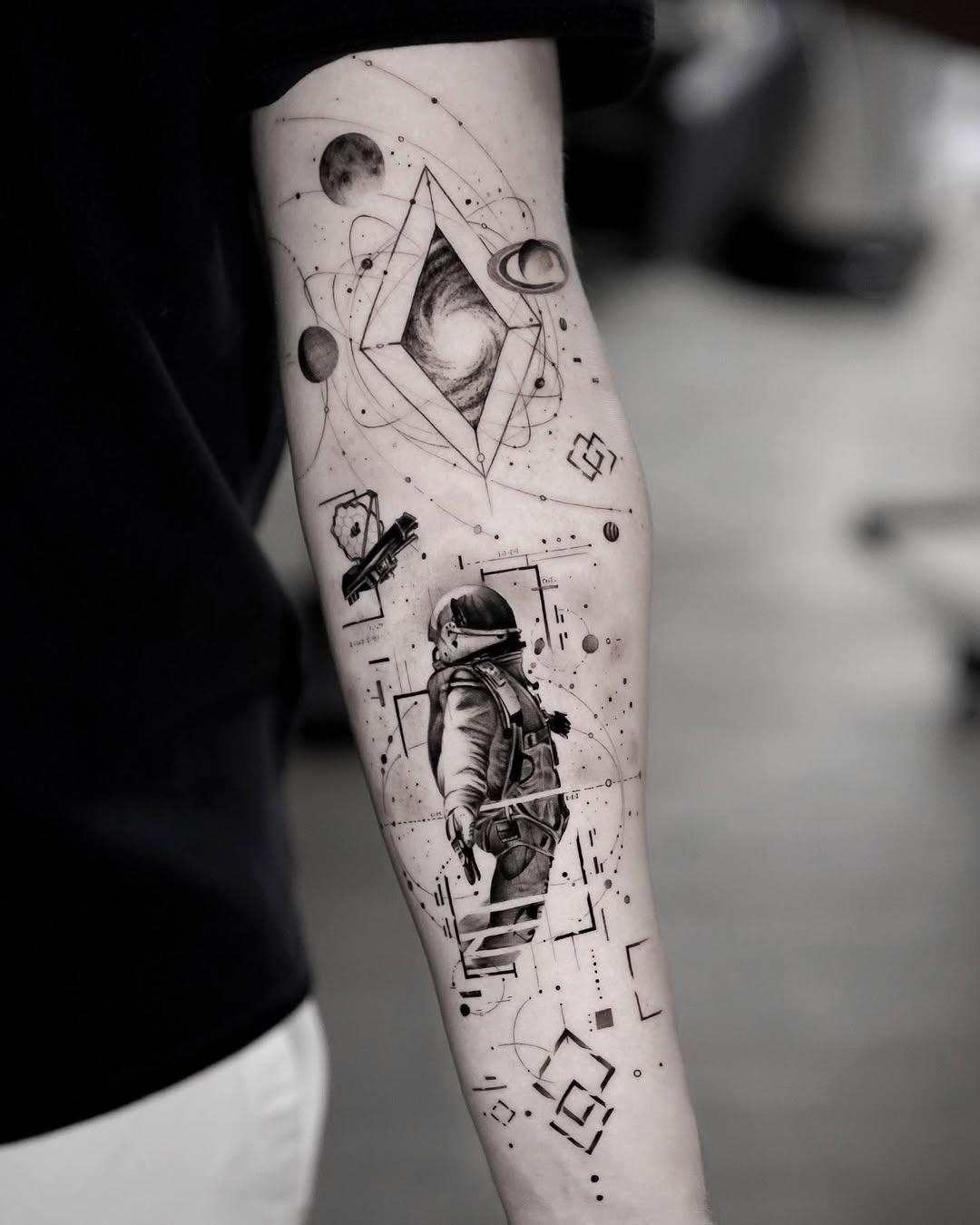 Stunning astronaut tattoo with cosmic elements Tattoo Design
