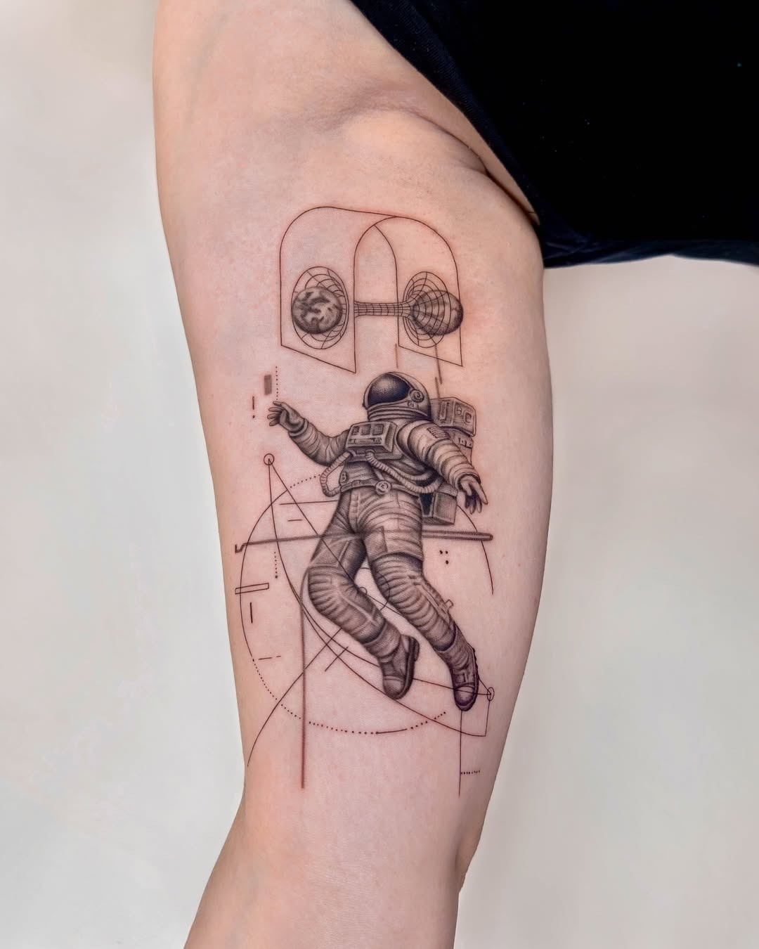 Unique astronaut tattoo celebrating space exploration Tattoo Design