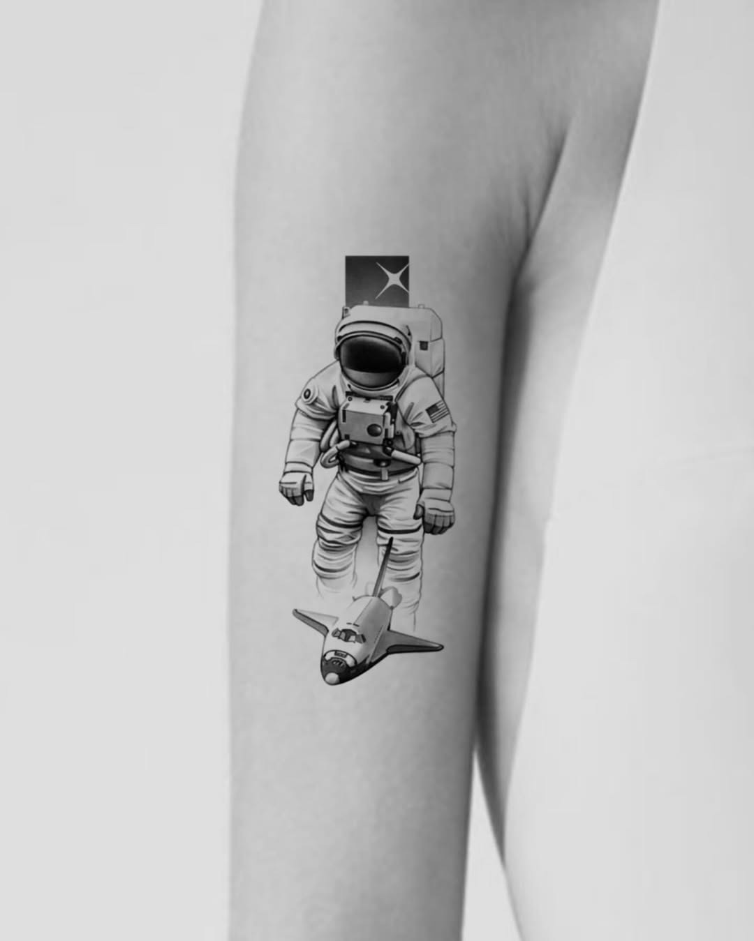 Unique astronaut tattoo with vintage rocket design Tattoo Design